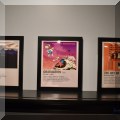 C02. Framed Kanye West album poster cards. 